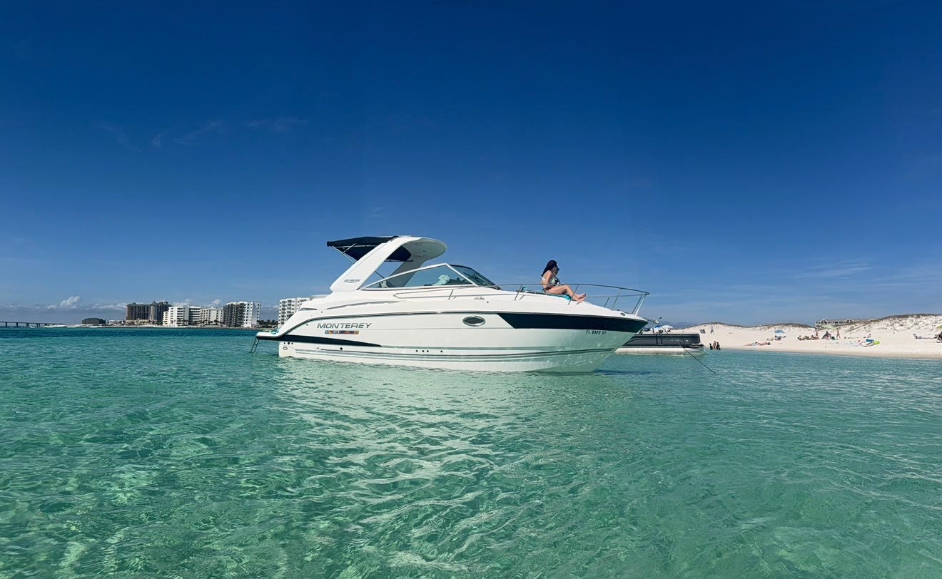 A family relaxing aboard the Salty Crook yacht on the Emerald Coast