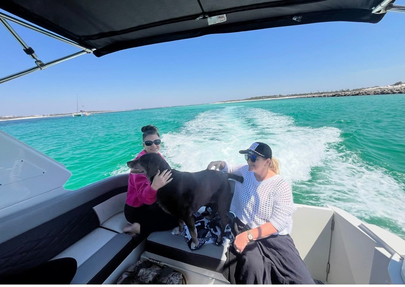Guests aboard the Salty Crook yacht on the Emerald Coast