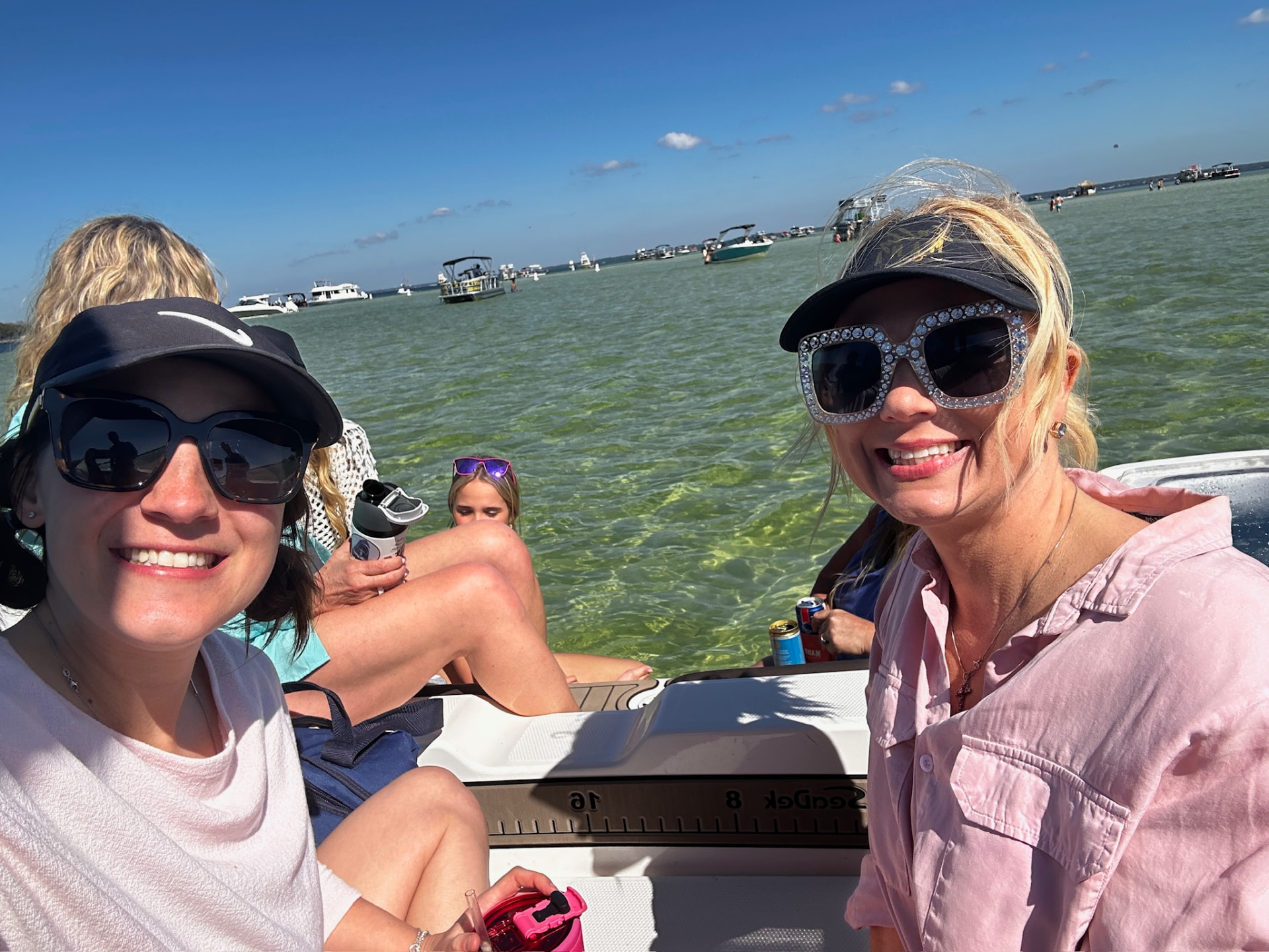 Guests on the bow of the Salty Crook yacht near Destin